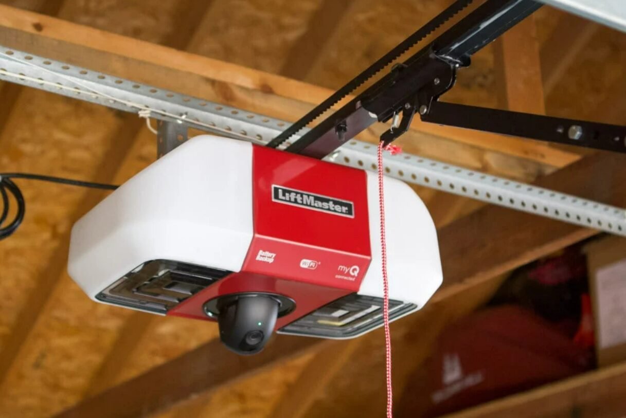 Technician performing a garage door opener installation for a residential property in Sarasota, FL, showcasing professional and reliable local garage door repair services.