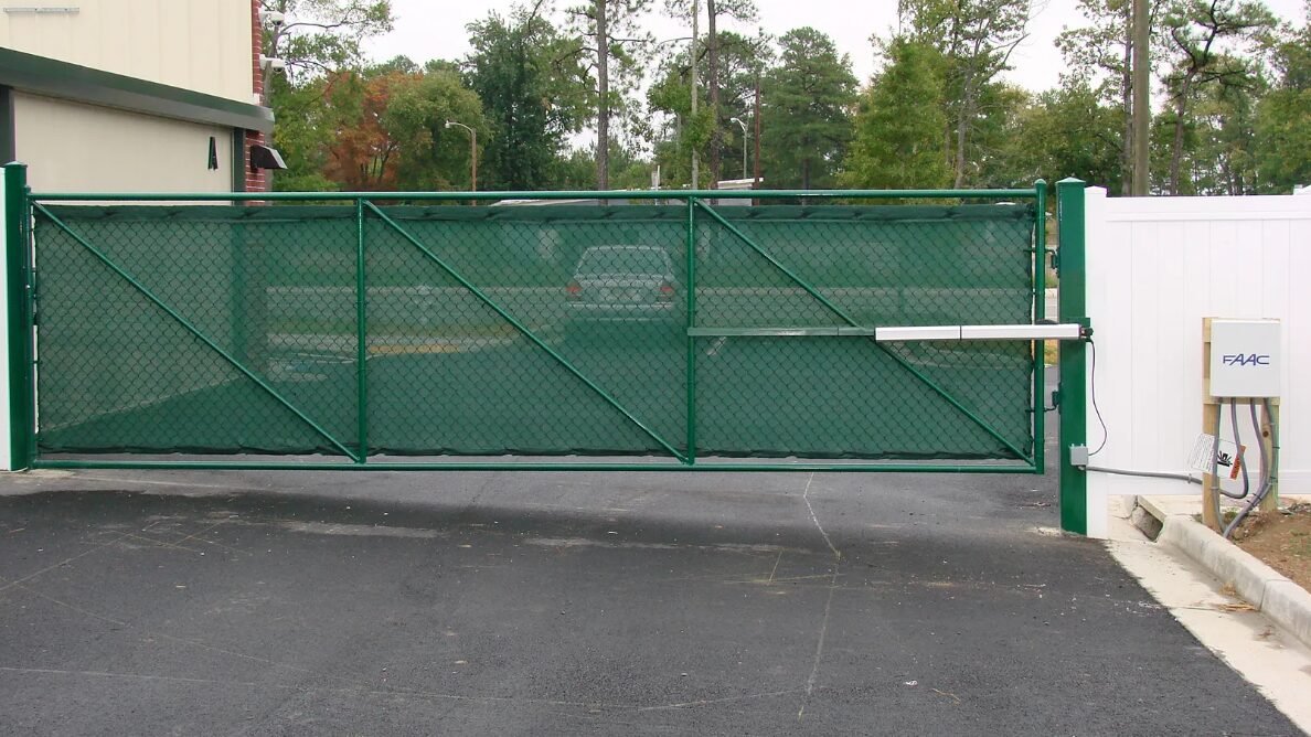 Technician performing commercial gate repair in Sarasota, FL, ensuring smooth and secure operation for local businesses.