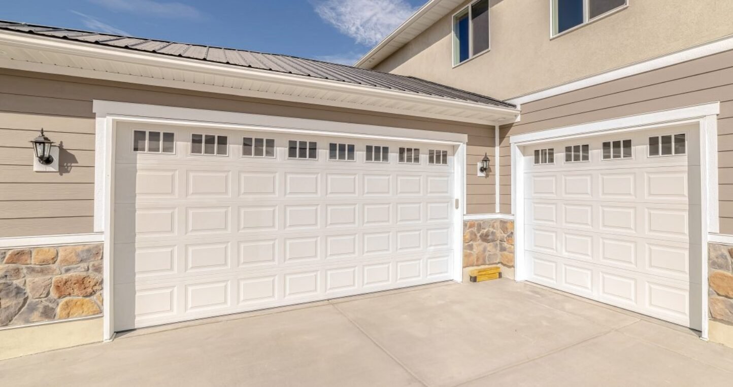 A professional technician performing garage door installation in Sarasota, FL, showcasing high-quality local garage door repair services.